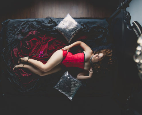 mellbella boudoir over the bed camera with a red corset