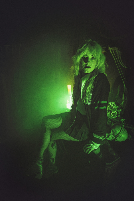 green light with a woman sitting on a table